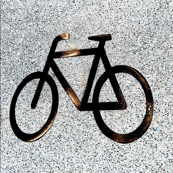 Ein schwarzes Fahrrad-Piktogramm auf Asphalt. 